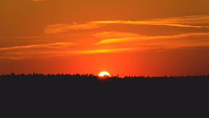 Baggrundsbillede med solnedgang over sletterne — Pro Display XDR Wallpapers