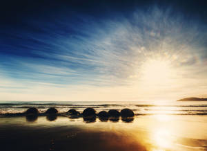 Moeraki Boulders Beach solopgang wallpaper — Solopgang Wallpapers