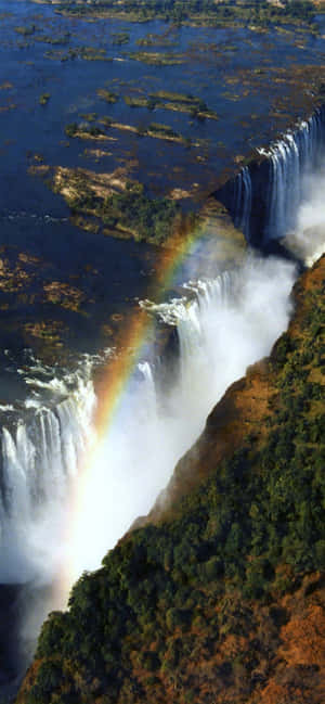 Victoria Falls med en regnbue — Pixel 8a Wallpapers